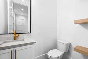 Bathroom with vanity and recessed lighting