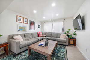 Living area featuring wood finished floors and recessed lighting
