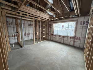 Misc room featuring unfinished concrete floors