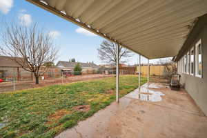 Fenced backyard featuring a patio