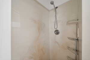 Bathroom view of a marble finish shower