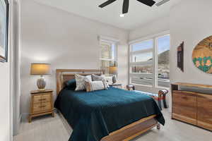 Bedroom with light colored carpet, a ceiling fan, and recessed lighting