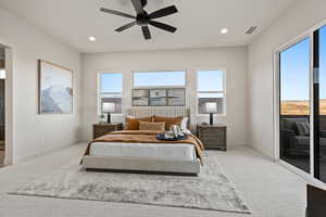 Carpeted bedroom featuring access to exterior, a ceiling fan, recessed lighting, and connected bathroom