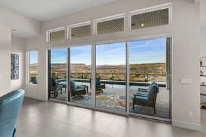 Doorway to outside featuring a mountain view and tile patterned floors
