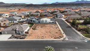 Aerial view of residential area featuring mountains