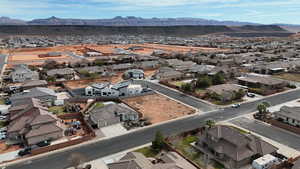 Aerial perspective of suburban area featuring a mountain backdrop