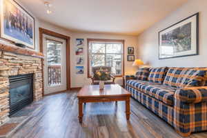 Living area featuring hardwood / wood-style floors and a fireplace