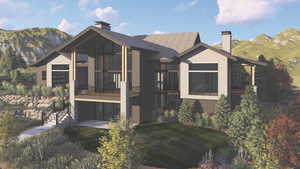 Back of property featuring a chimney, a mountain view, a sunroom, a shingled roof, and a yard