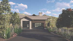 View of front of house featuring a chimney, roof with shingles, an attached garage, driveway, and a mountain view