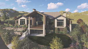 Back of property featuring a chimney, a mountain view, a lawn, and roof with shingles