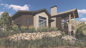 View of side of property featuring a balcony and a chimney