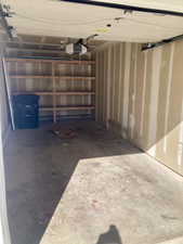 Garage featuring a garage door opener