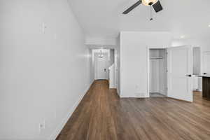 Unfurnished bedroom featuring dark wood-style flooring, ceiling fan, a closet, and recessed lighting