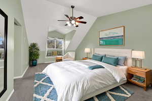 Bedroom featuring carpet, ceiling fan, and lofted ceiling