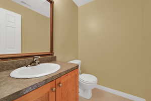 Bathroom featuring vanity and light tile patterned floors