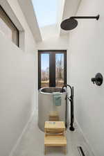 Detailed view of a soaking tub and french doors