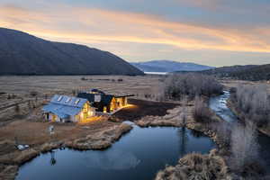 Aerial view at dusk of a water and mountain view