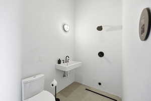 Half bath featuring toilet