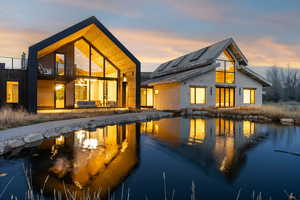 Back of property featuring a patio and an outdoor living space