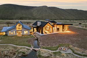 Expansive architectural residence featuring multiple structures with a contemporary design