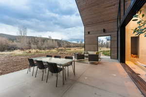 Expansive concrete patio offering multiple outdoor living zones