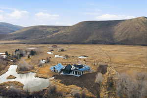 Sprawling rural property featuring multiple structures, natural ponds, and extensive open land