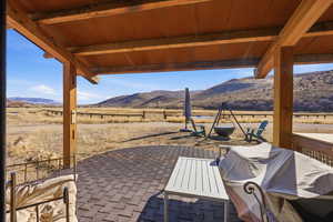View of patio featuring a mountain view and a rural view