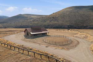 View of mountain background featuring rural landscape