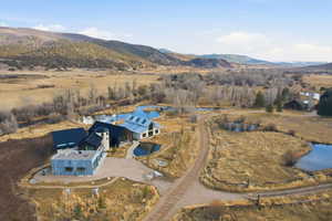 Expansive property featuring multiple structures with contemporary and rustic architectural elements
