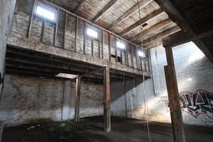 Miscellaneous room with a high wood ceiling