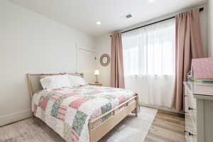 Bedroom featuring light wood-style flooring and recessed lighting
