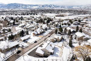 Snowy aerial view with a mountain view