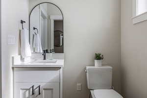 Bathroom featuring vanity and toilet