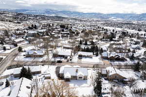 Snowy aerial view with a mountain view