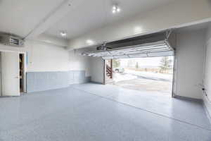 Garage featuring a heating unit