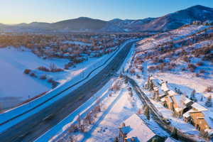 View of mountain background featuring nearby suburban area