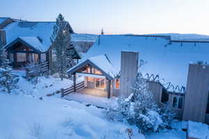 View of front facade featuring a wooden deck