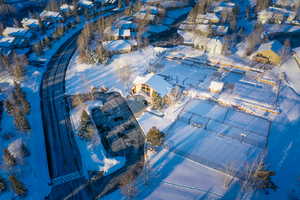 Snowy aerial view featuring a residential view