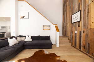 Living area featuring wood walls and wood finished floors