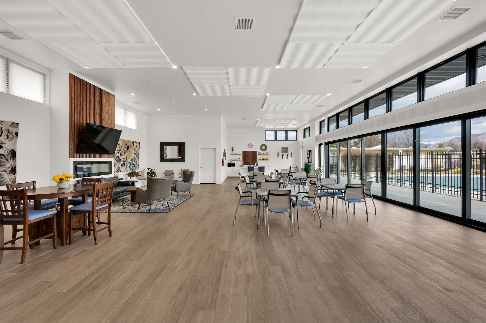 Dining room featuring a high ceiling and light wood-style flooring