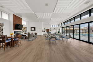 Dining room featuring a high ceiling and light wood-style flooring