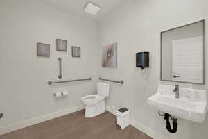Bathroom featuring toilet and baseboards