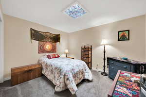 Carpeted bedroom with baseboards