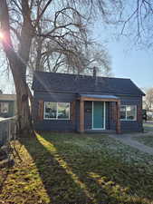 View of front of property with a shingled roof