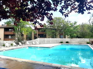 Community pool featuring a patio