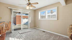 Spare room with carpet floors and a ceiling fan