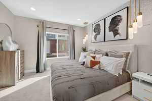 Bedroom with light colored carpet and recessed lighting
