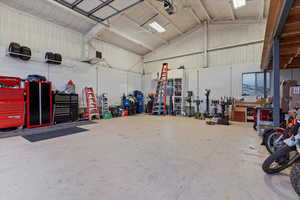 Garage featuring a heating unit and a garage door opener