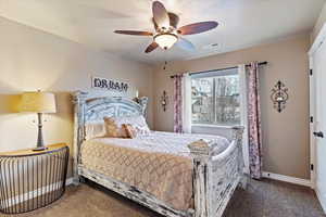 Bedroom featuring carpet floors and ceiling fan