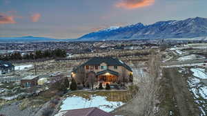 Snowy aerial view featuring a mountain view